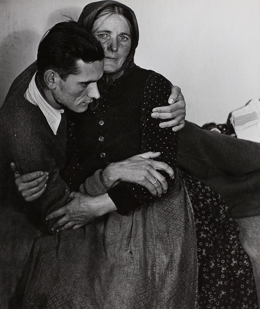Madame d’Ora (Dora Kallmus), Woman Supporting a Sickly Man at a Displaced Persons Camp in Austria, 1948
